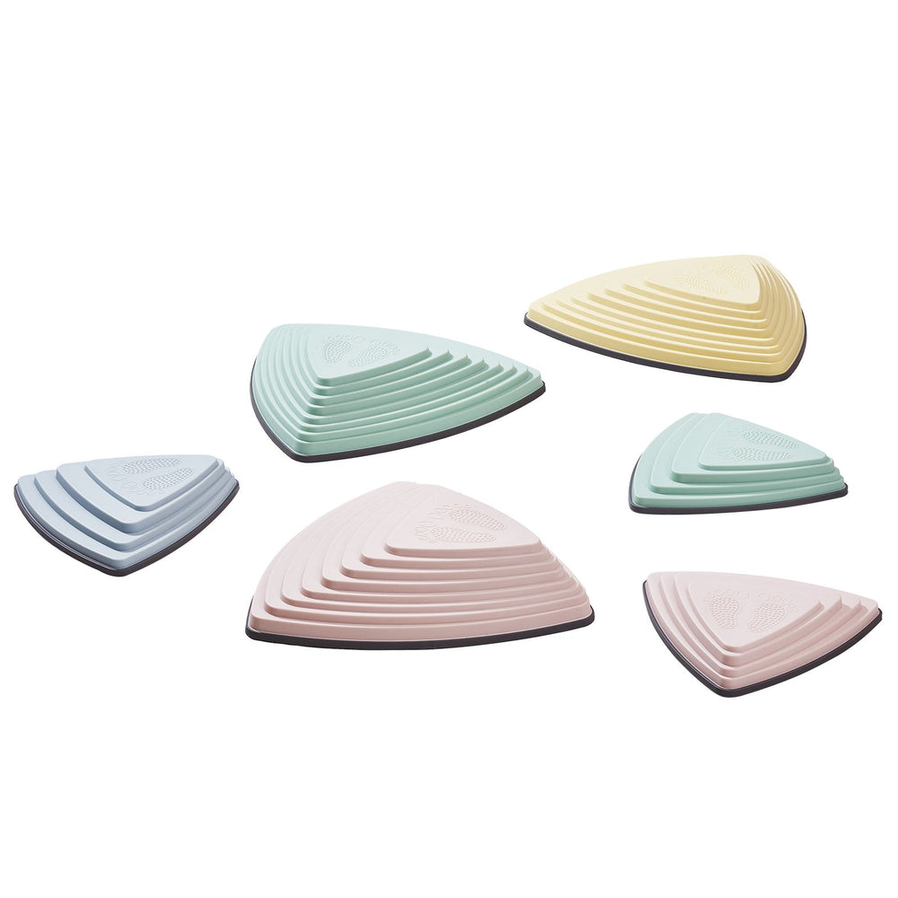 Six pastel balance stepping stones arranged on a white background, showing their raised textured surfaces.